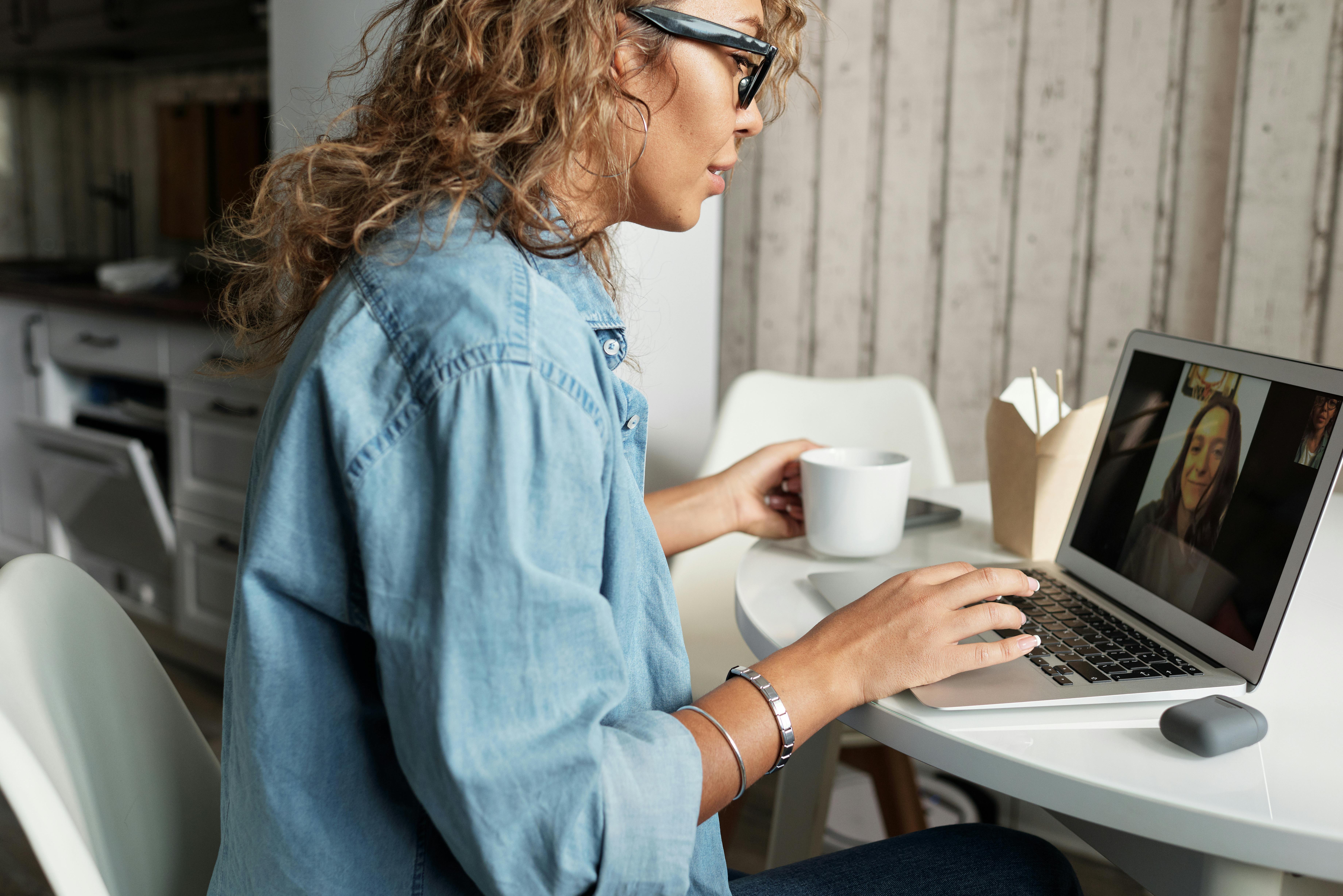 Image of woman in front of video call to insinuate good skin makes you feel good